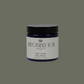 Impossibly you palo santo scented body butter with a green background