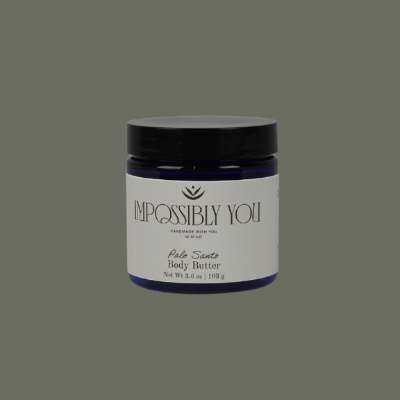 Impossibly you palo santo scented body butter with a green background