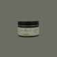 Impossibly You siren scented soy wax candle with a green background