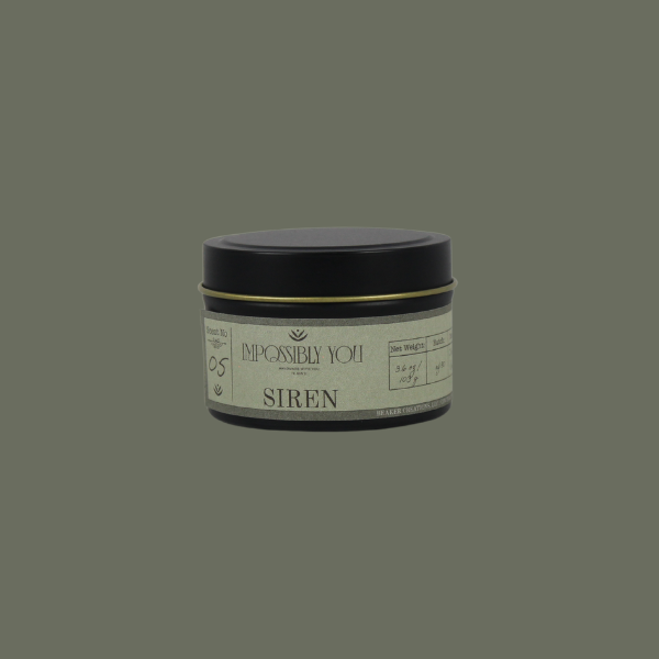 Impossibly You siren scented soy wax candle with a green background
