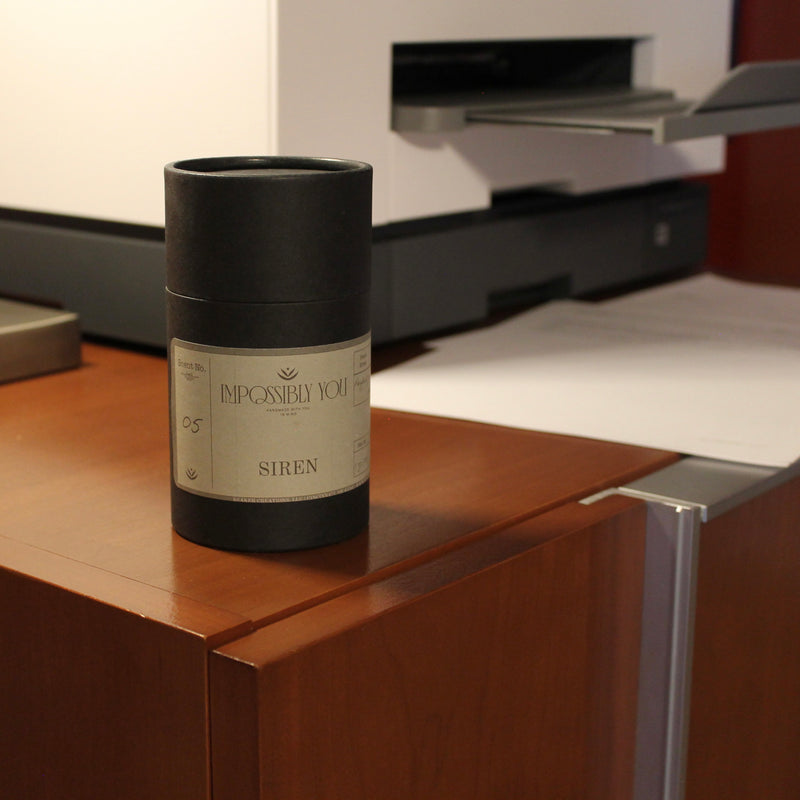 siren scented Impossibly You wax melts on an office cabinet next to a printer.